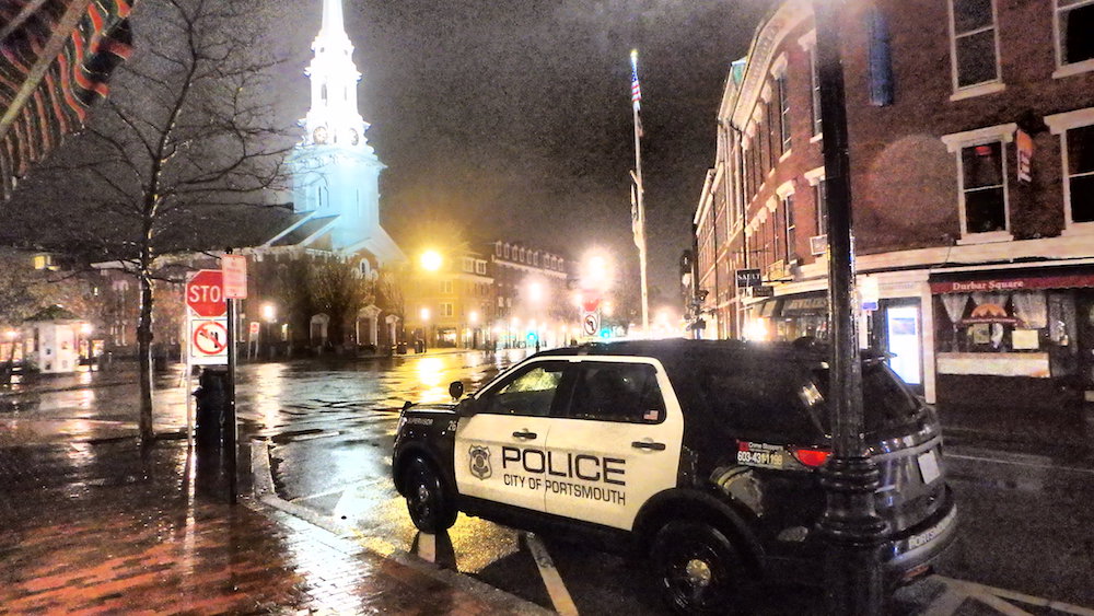 Police vehicle in Market Square at night