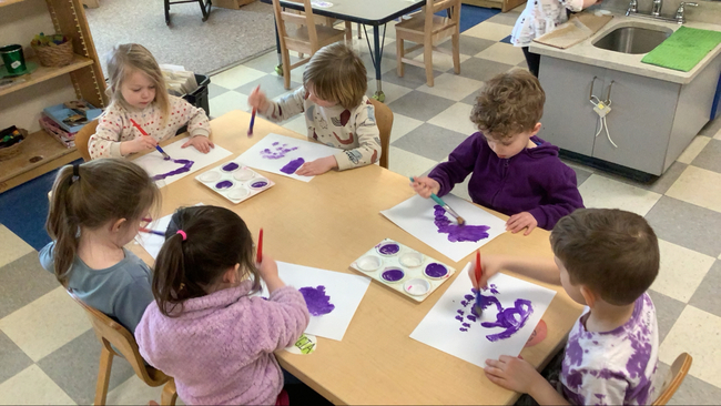 Children painting at SCS