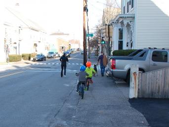 Kids riding bicycles on Islington Street