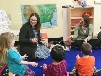 Librarian Story Time with three children