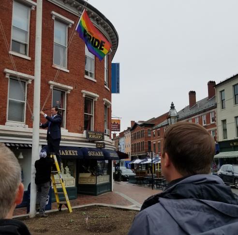 Mayor McEachern raises the LGBTQ+ Pride flag in Market Sq.