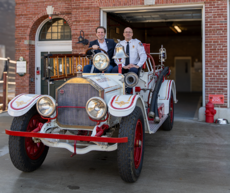 Portsmouth NH Mayor Deaglan McEachern and Fire Chief William McQuillen in the 1920s antique fire truck gifted to the City by Bayberry Vintage Auto. 